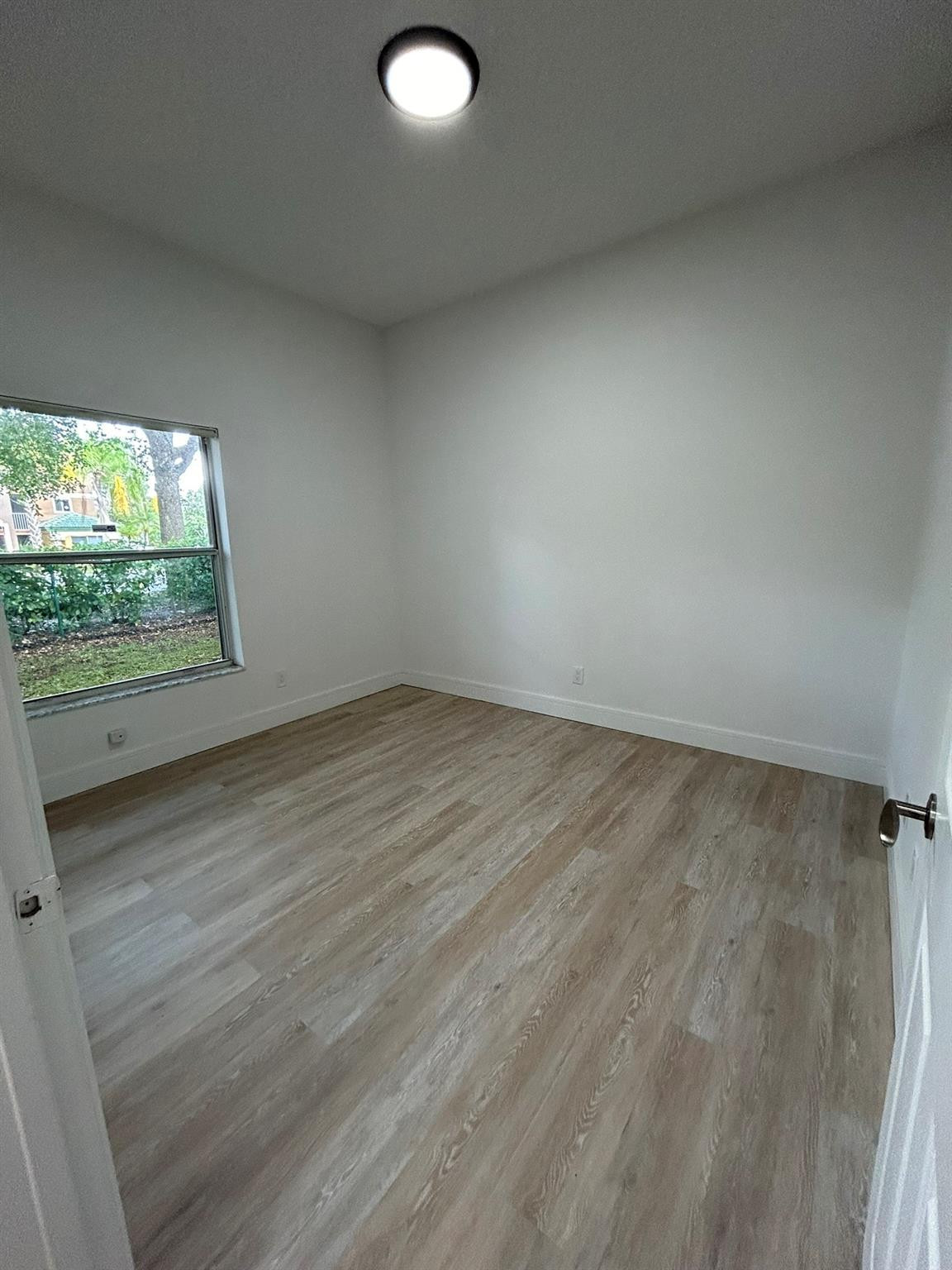 16223 Emerald Cove Road, Unit 16223 Weston, FL 33331 - Photo 19 of 38 an empty room with a window