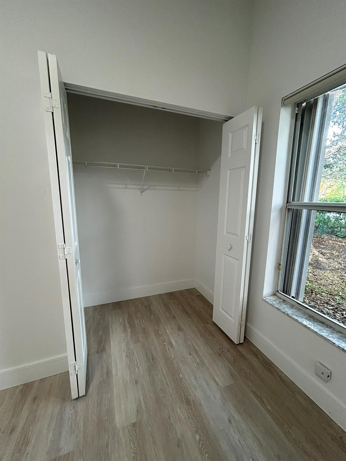 16223 Emerald Cove Road, Unit 16223 Weston, FL 33331 - Photo 21 of 38 an empty room with wooden floor and a window