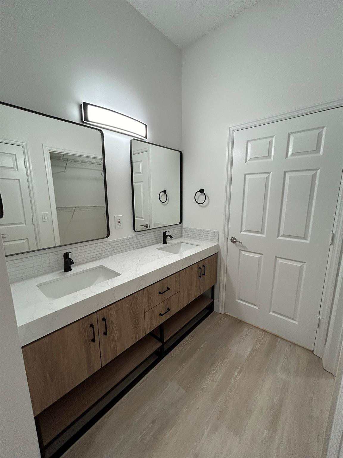 16223 Emerald Cove Road, Unit 16223 Weston, FL 33331 - Photo 25 of 38 a bathroom with a double vanity sink and mirror