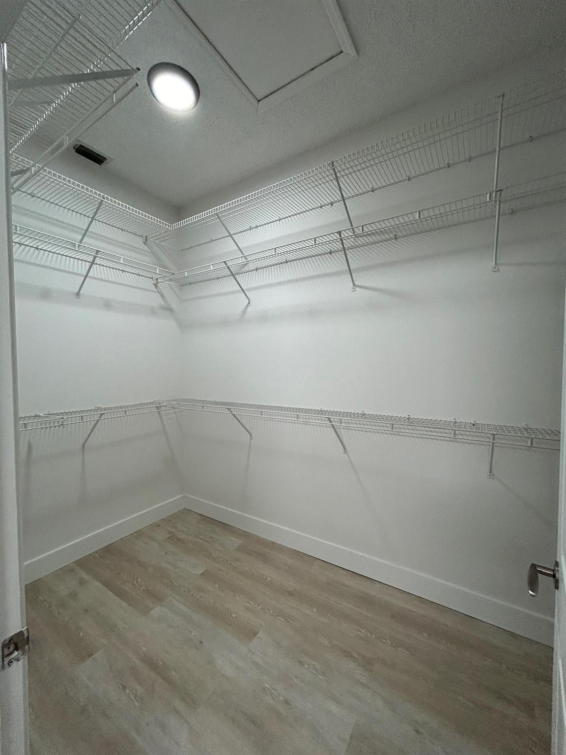 16223 Emerald Cove Road, Unit 16223 Weston, FL 33331 - Photo 26 of 38 a view of a room with racks on the wall