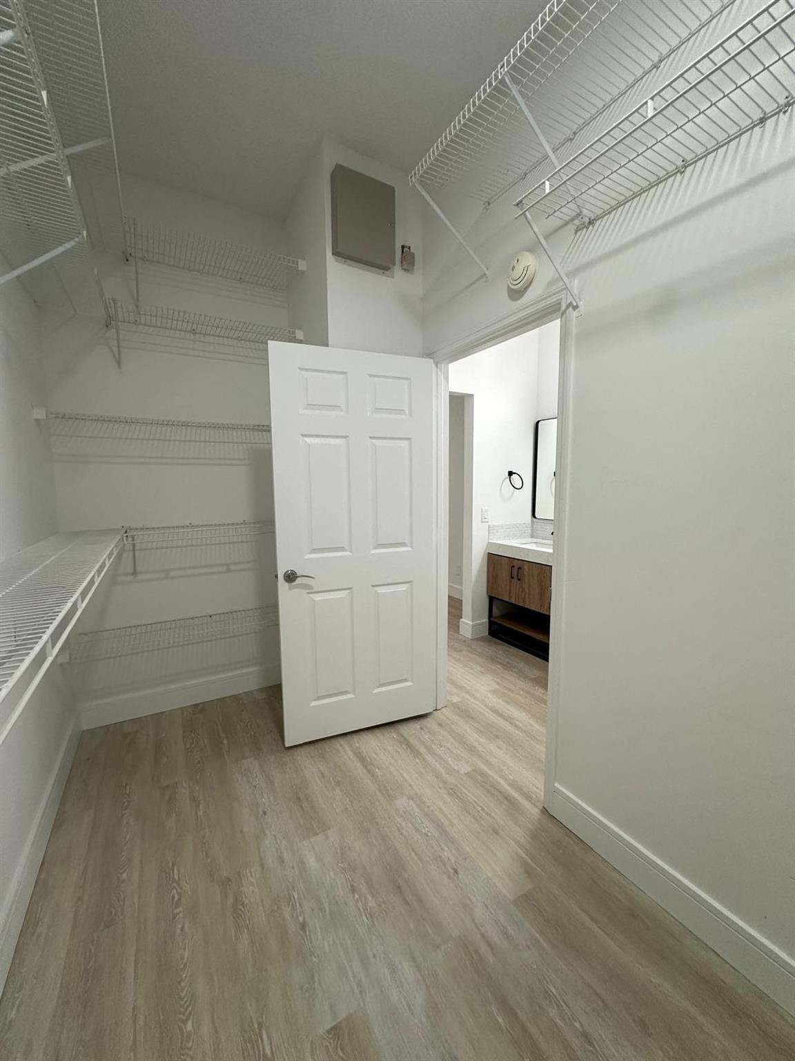 16223 Emerald Cove Road, Unit 16223 Weston, FL 33331 - Photo 28 of 38 a view of empty room with wooden floor and cabinet