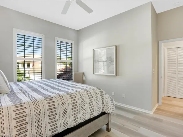 a bedroom with a bed and chair