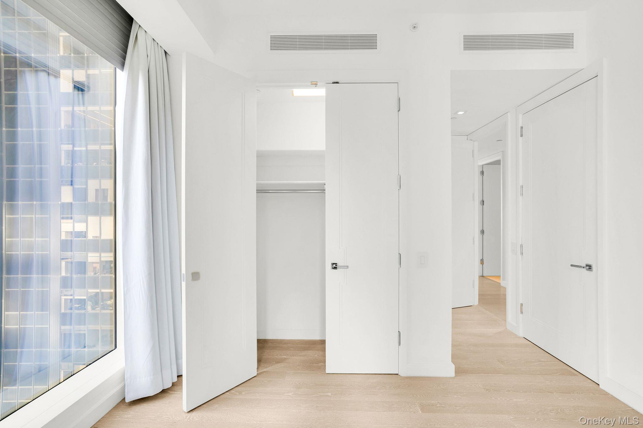 138 East 50th Street, Unit 26C Manhattan, NY 10022 - Photo 18 of 31 a view of a bathroom with a shower