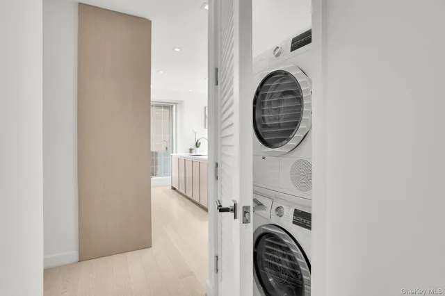 a close view of utility room with washer and dryer