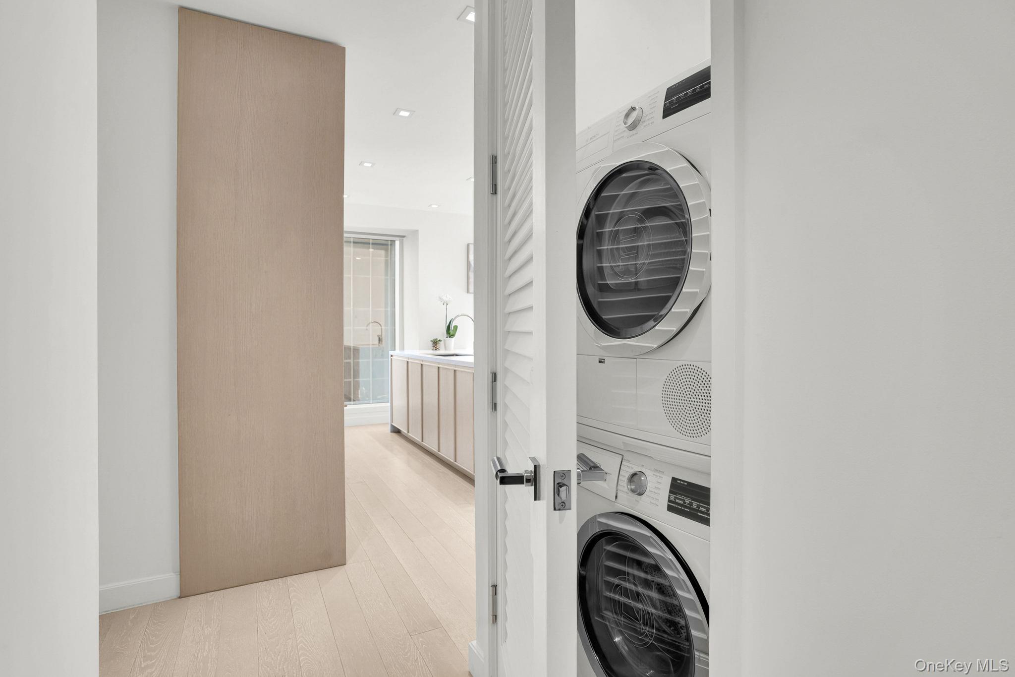 138 East 50th Street, Unit 26C Manhattan, NY 10022 - Photo 28 of 31 a close view of utility room with washer and dryer