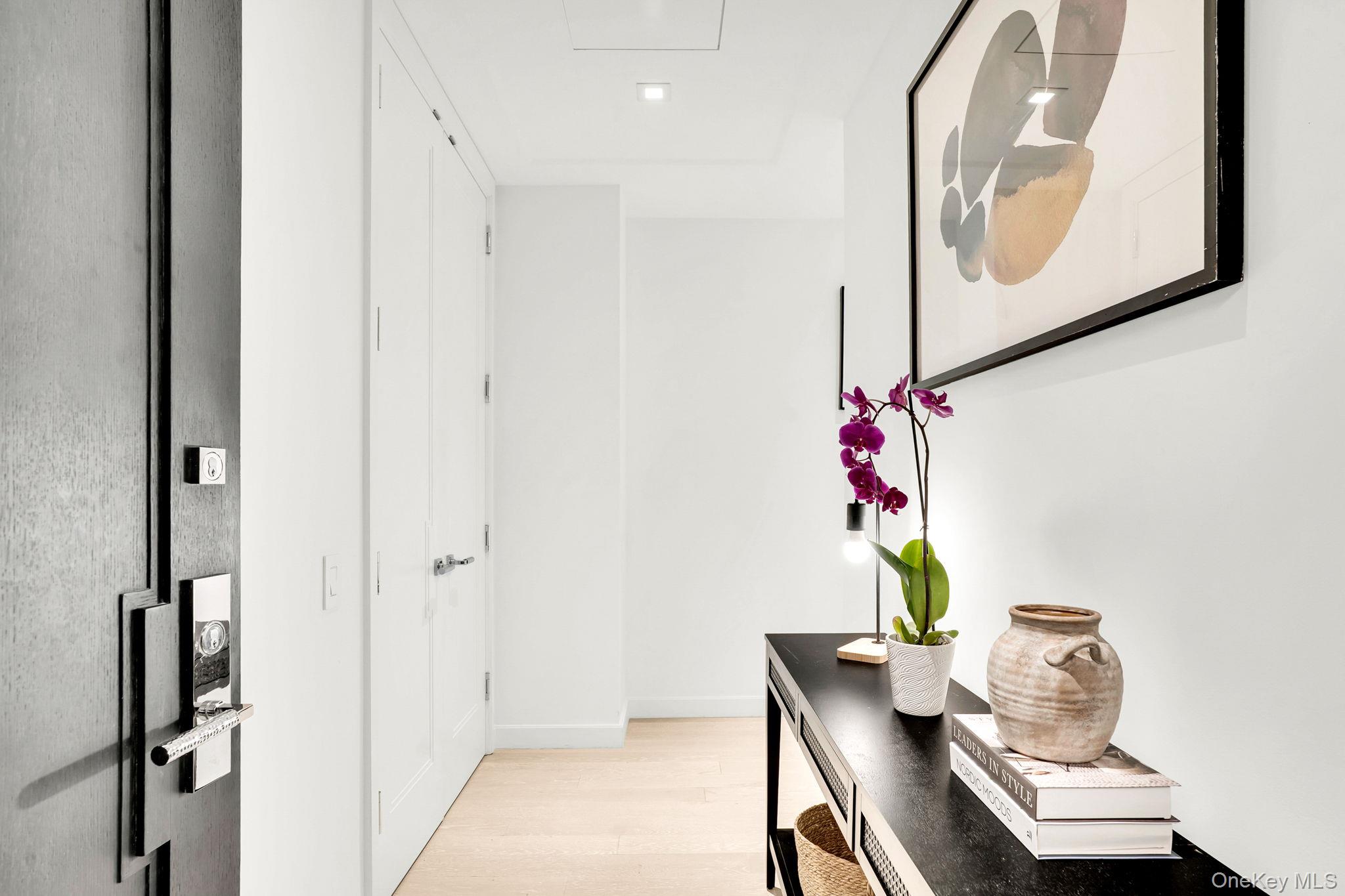 138 East 50th Street, Unit 26C Manhattan, NY 10022 - Photo 3 of 31 a workspace with furniture and mirror