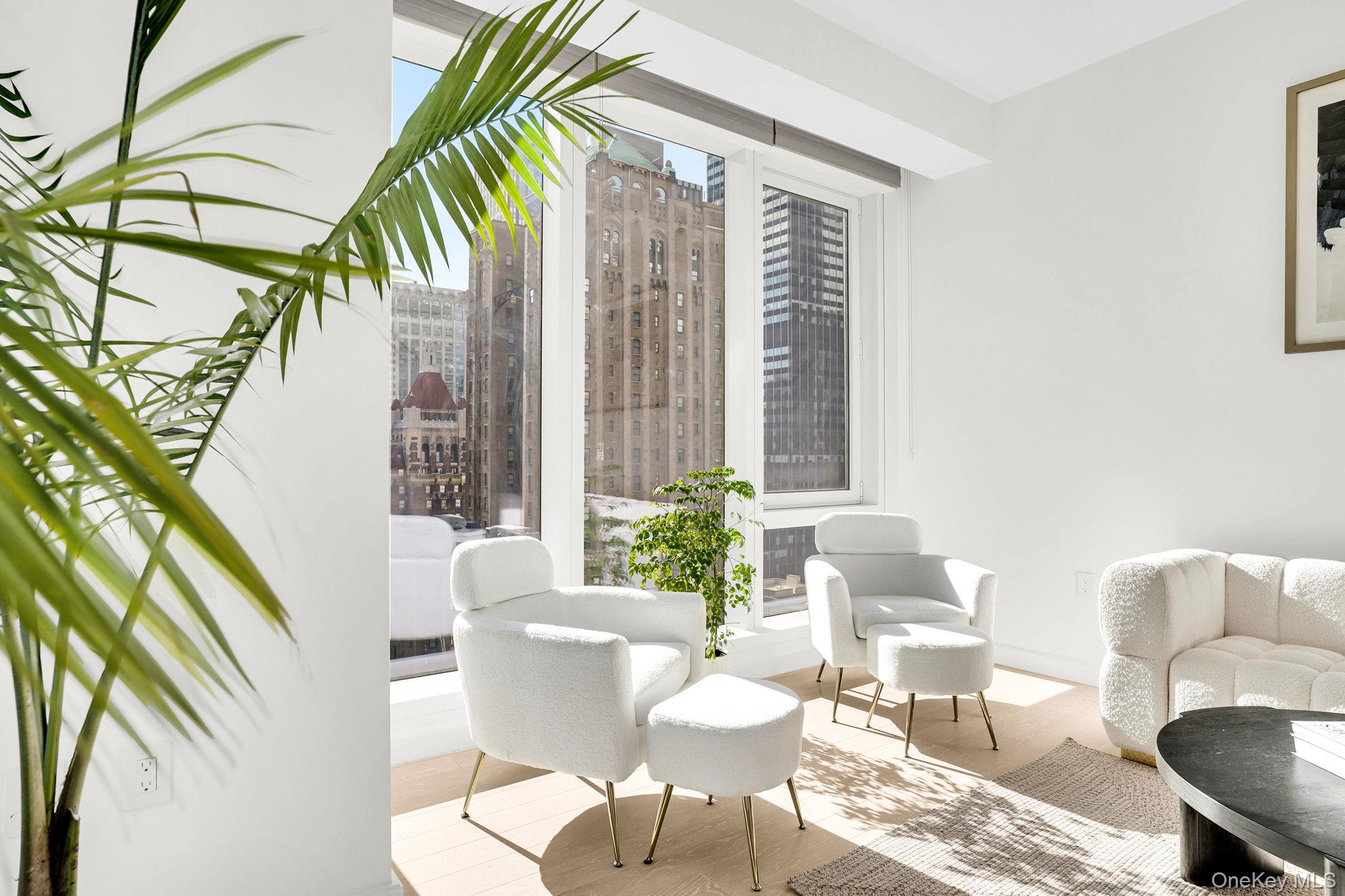 138 East 50th Street, Unit 26C Manhattan, NY 10022 - Photo 7 of 31 a living room with furniture and a potted plant