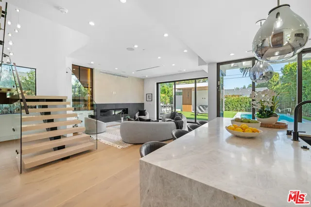 a view of a living room and dining room
