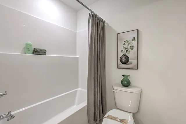 a bathroom with double vanity sinks and a mirror