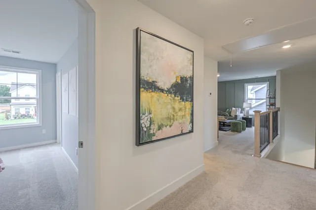 a spacious bathroom with a tub sink and mirror