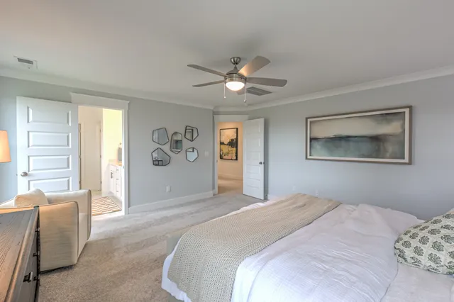 a kitchen with stainless steel appliances granite countertop a dining table chairs refrigerator sink and cabinets