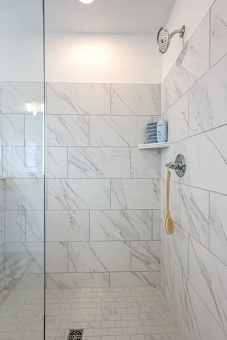 a front view of a house with a yard table and chairs