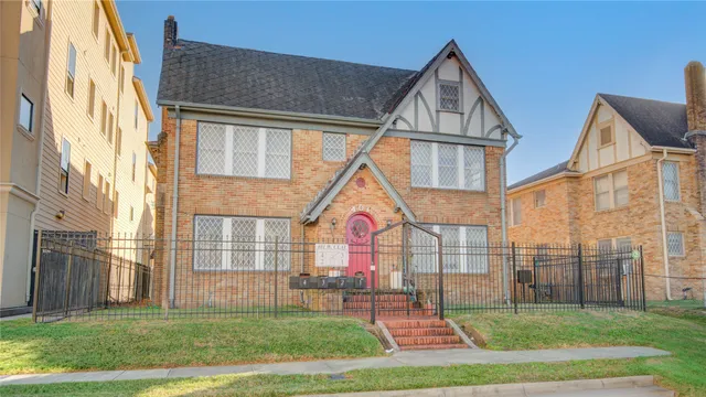 a view of residential houses with yard and slide