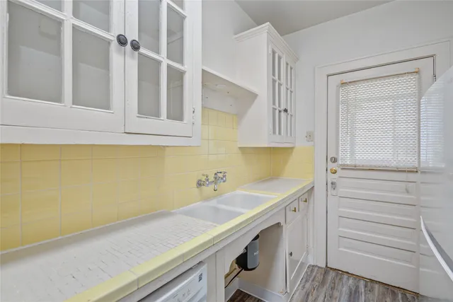 a bathroom with a sink a vanity and a mirror