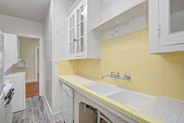 a kitchen with a stove and a refrigerator