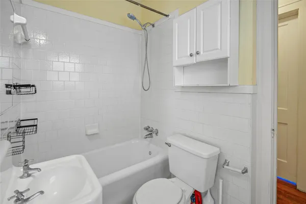 a bathroom with a sink a bathtub and a shower