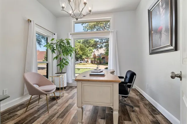 a work room with furniture and a window