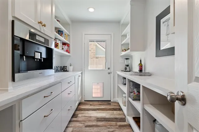 a spacious bathroom with a double vanity sink and a mirror