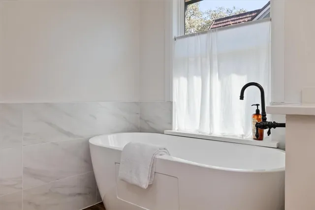 a bath tub sitting in a bathroom