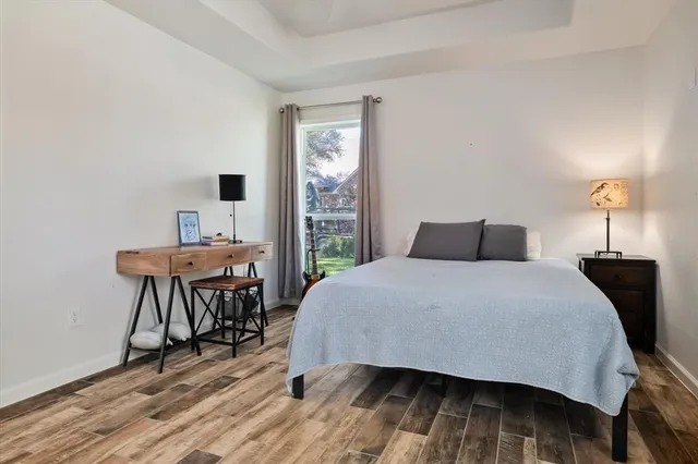 a bedroom with a bed and a table