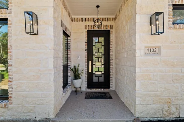 a bathroom with a shower and a sink