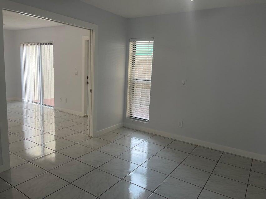 639 Executive Center Drive, Unit O107 West Palm Beach, FL 33401 - Photo 13 of 21 an empty room with windows