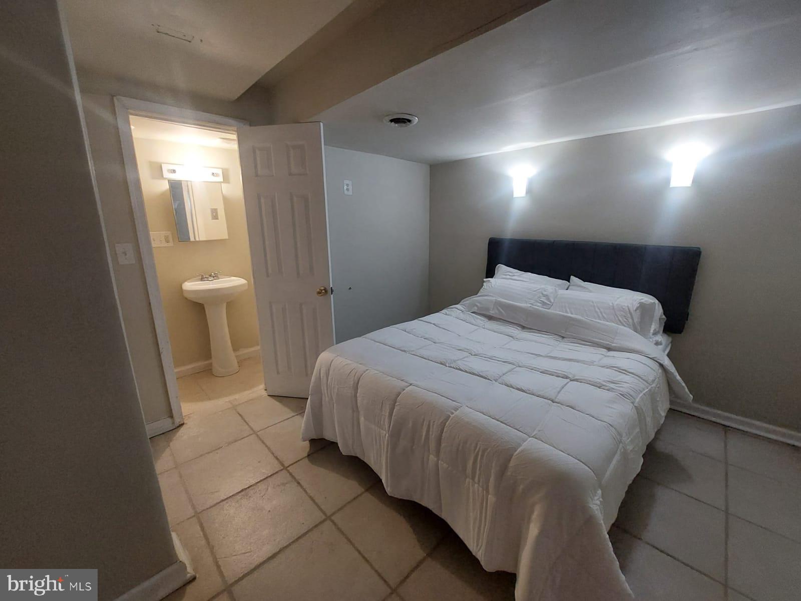 14606 Dewey Ridge Court Bowie, MD 20721 - Photo 6 of 11 a bedroom with a bed and a window