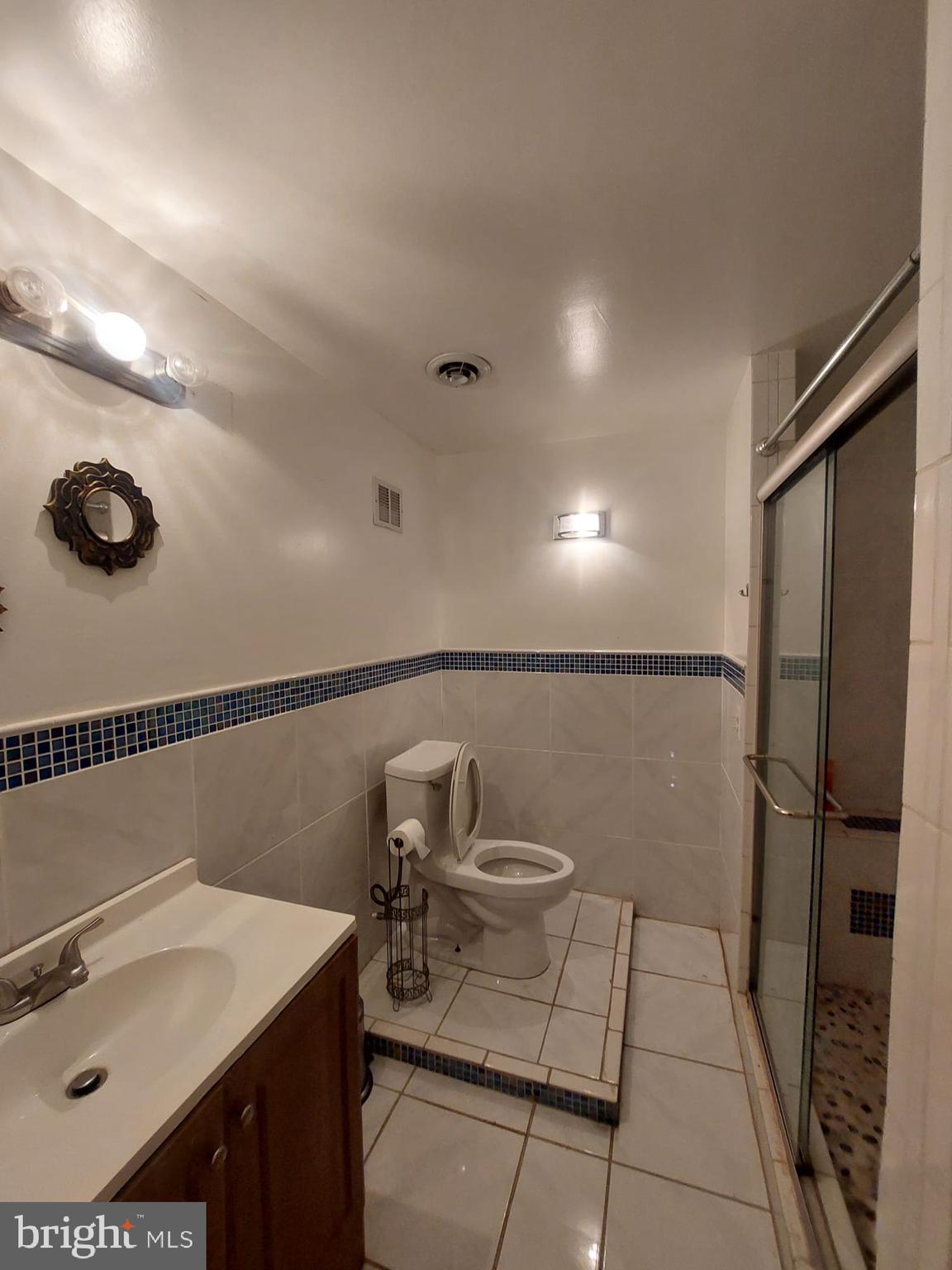 14606 Dewey Ridge Court Bowie, MD 20721 - Photo 8 of 11 a bathroom with a sink toilet and shower