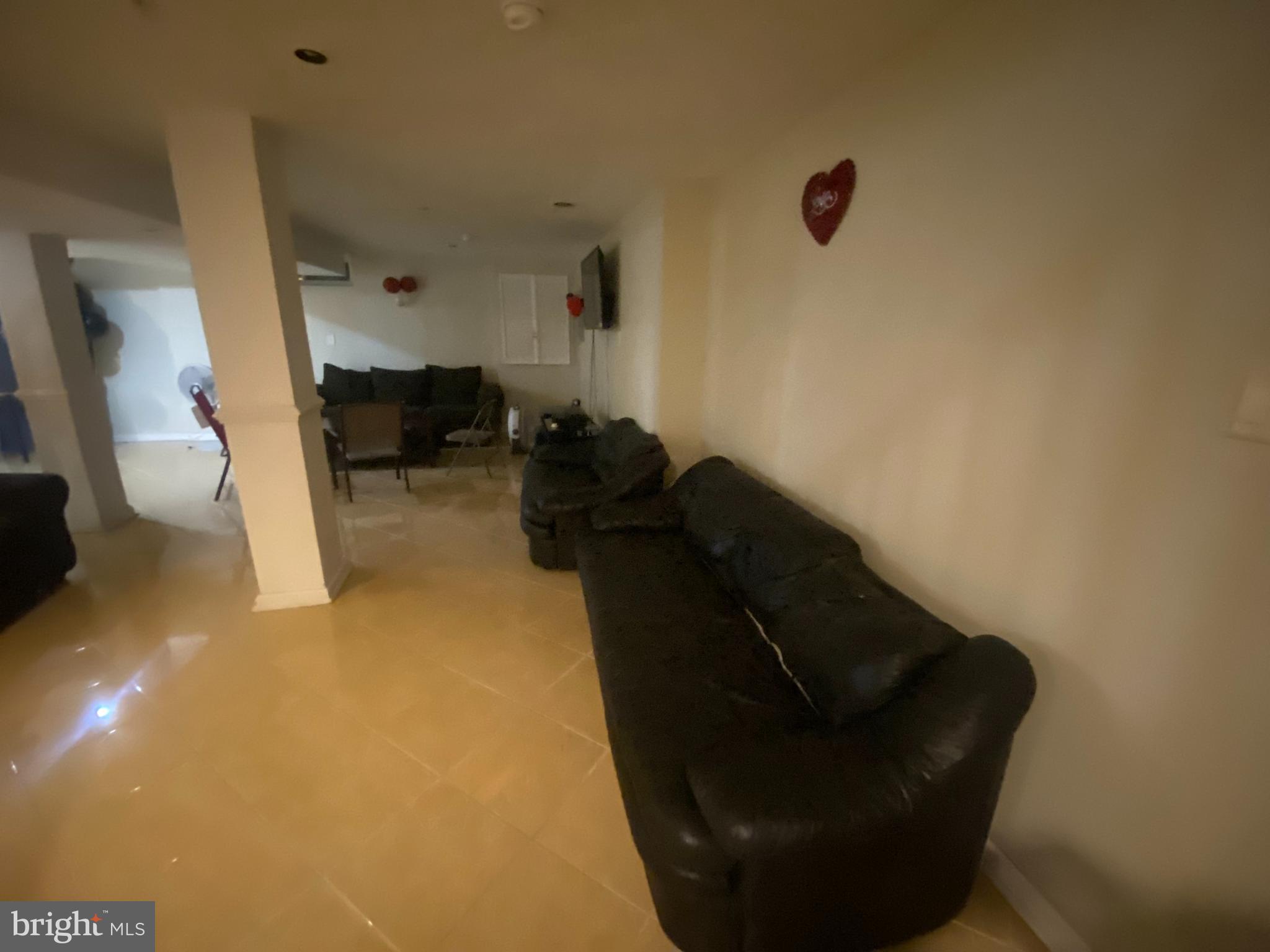 14606 Dewey Ridge Court Bowie, MD 20721 - Photo 10 of 11 a living room with furniture and a gate