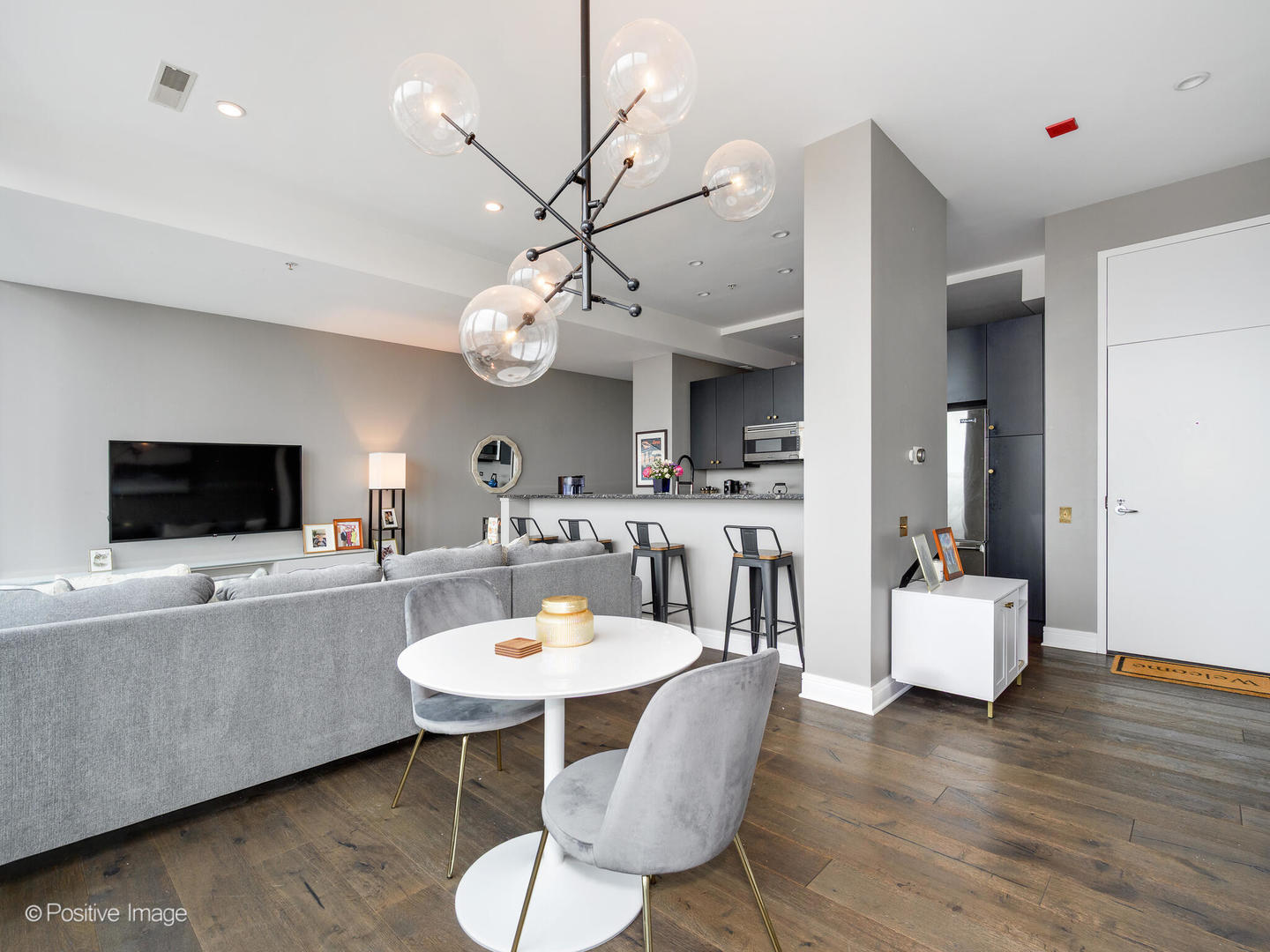 500 West Superior Street, Unit 1202 Chicago, IL 60654 - Photo 8 of 29 a view of a dining room with furniture and wooden floor