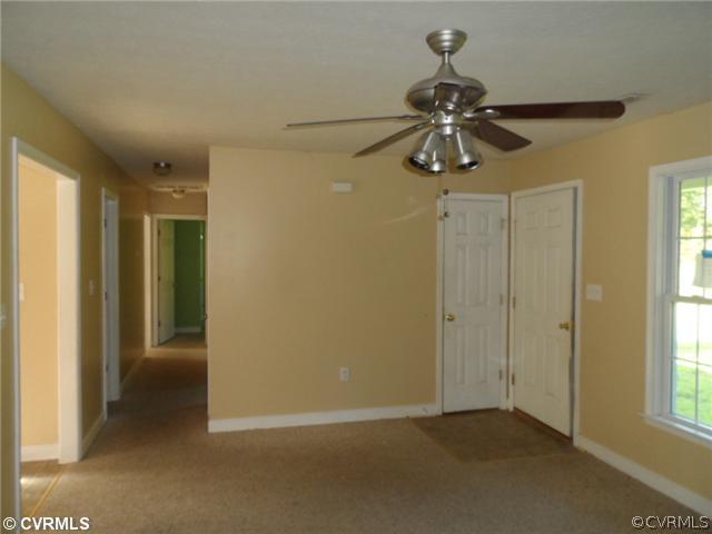 4166 Wakema Road West Point, VA 23181 - Photo 3 of 10 a view of a chandelier fan in a room
