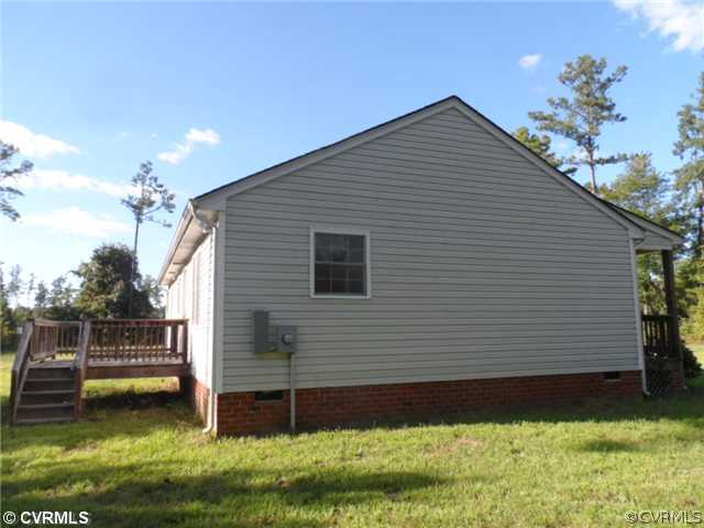 4166 Wakema Road West Point, VA 23181 - Photo 9 of 10 a view of a house with a yard
