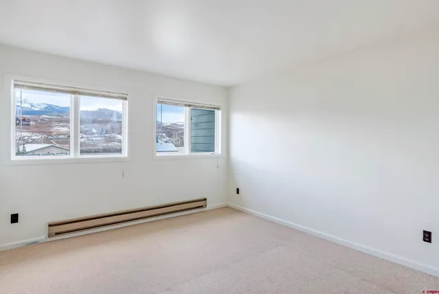 a view of a balcony with wooden floor