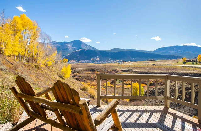a view of a swimming pool with a table and chairs
