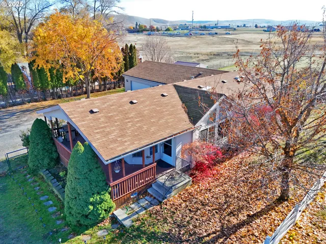an aerial view of a house with a lake view