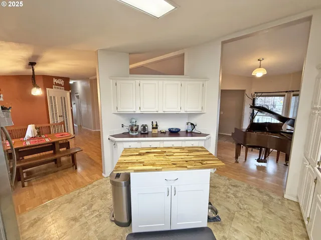 a room with furniture and wooden floor