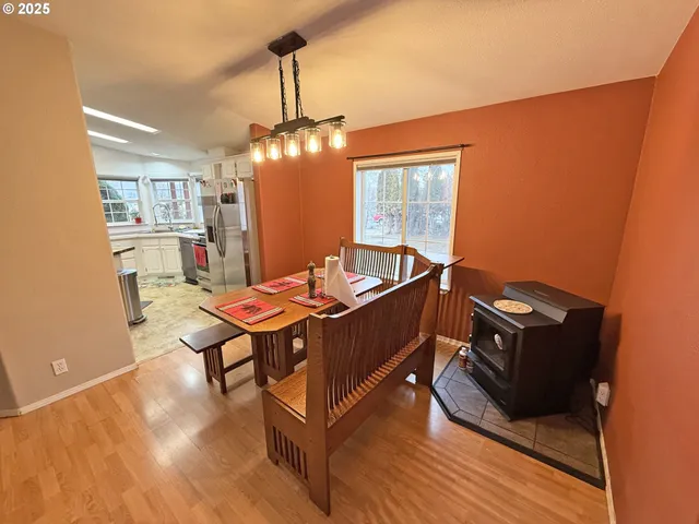 a view of bedroom with a fireplace and a ceiling fan