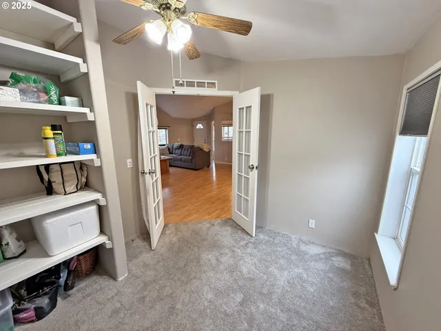 a view of hallway with wooden floor
