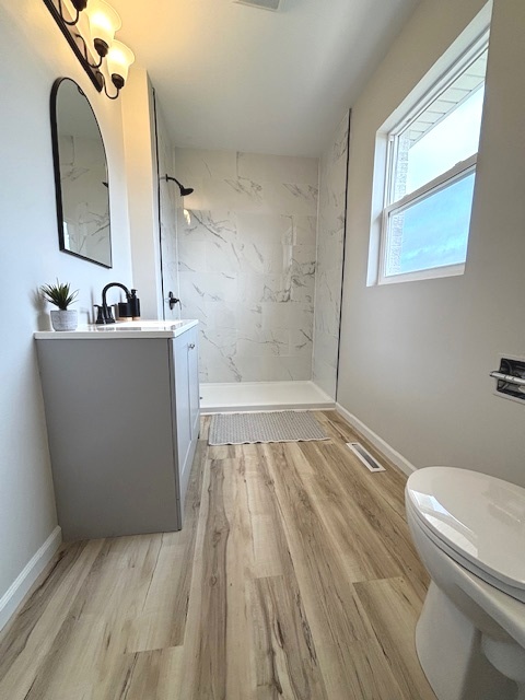 12482 Grove Road Minooka, IL 60447 - Photo 17 of 23 a bathroom with a sink a toilet and a mirror