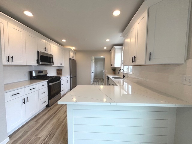 12482 Grove Road Minooka, IL 60447 - Photo 8 of 23 a kitchen with kitchen island granite countertop a sink stainless steel appliances and white cabinets