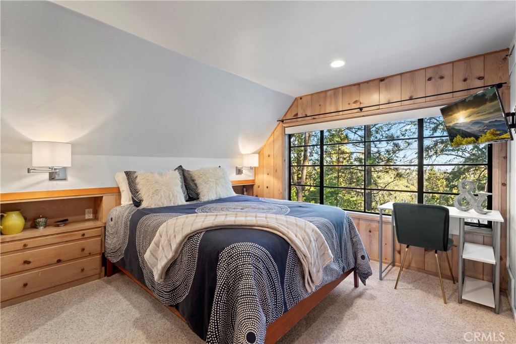 309 Castle Gate Road Lake Arrowhead, CA 92352 - Photo 29 of 58 a large bed sitting in a bedroom next to a window