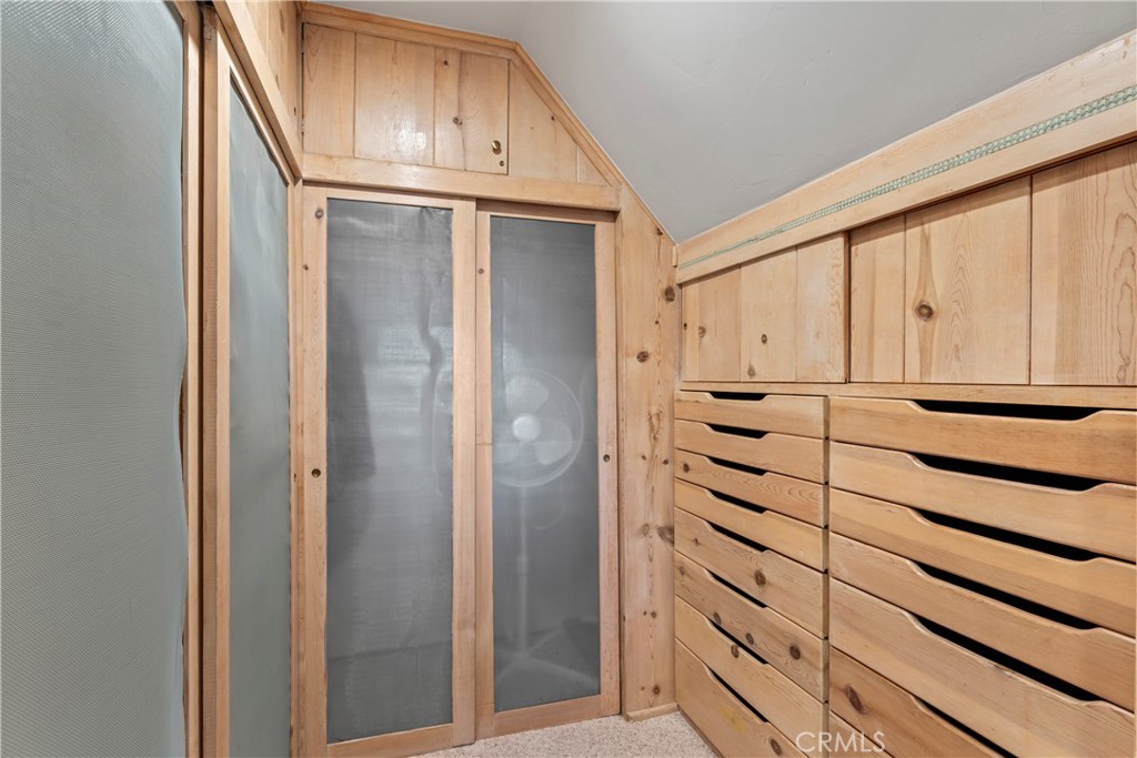 309 Castle Gate Road Lake Arrowhead, CA 92352 - Photo 33 of 58 a kitchen with stainless steel appliances cabinets and a window
