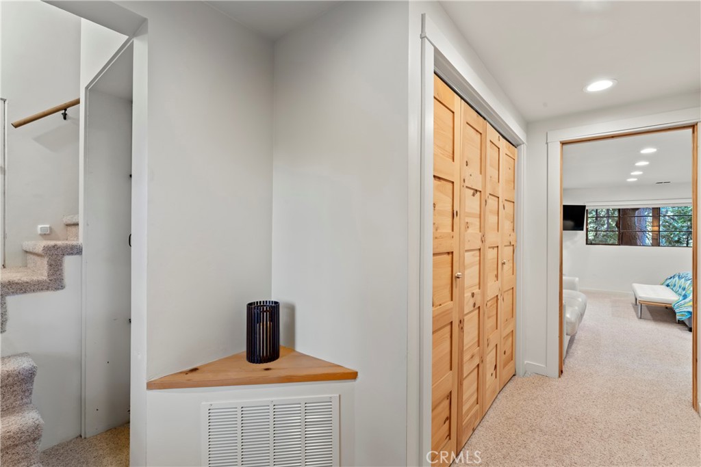 309 Castle Gate Road Lake Arrowhead, CA 92352 - Photo 38 of 58 a view of a hallway with a livingroom and a window