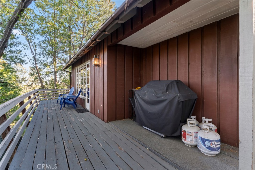 309 Castle Gate Road Lake Arrowhead, CA 92352 - Photo 55 of 58 a view of a deck with wooden floor and seating space