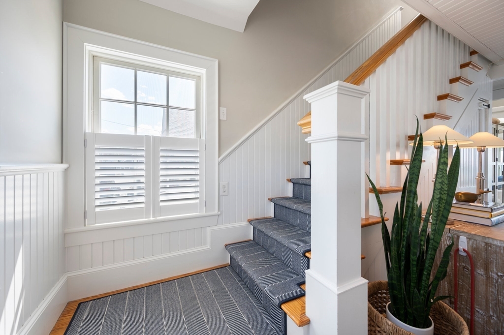 87 Bay Street Hull, MA 02045 - Photo 12 of 30 a view of an entryway with wooden floor and a potted plant
