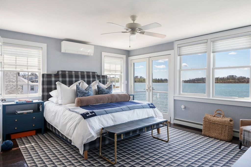 87 Bay Street Hull, MA 02045 - Photo 14 of 30 a bedroom with a large bed and a couch