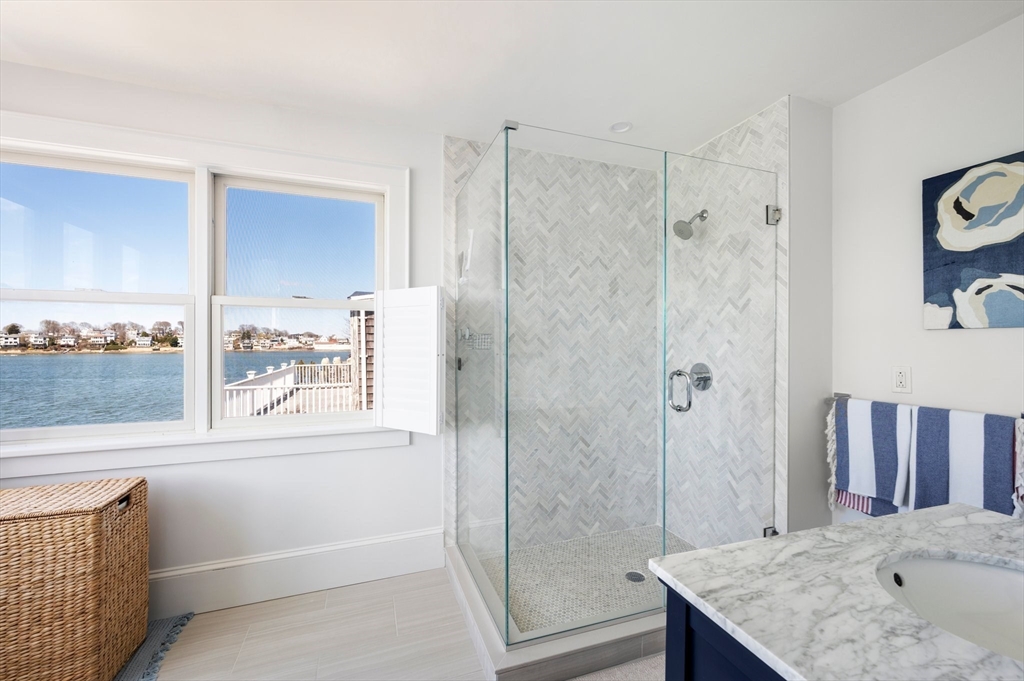 87 Bay Street Hull, MA 02045 - Photo 15 of 30 a bathroom with a shower and a sink