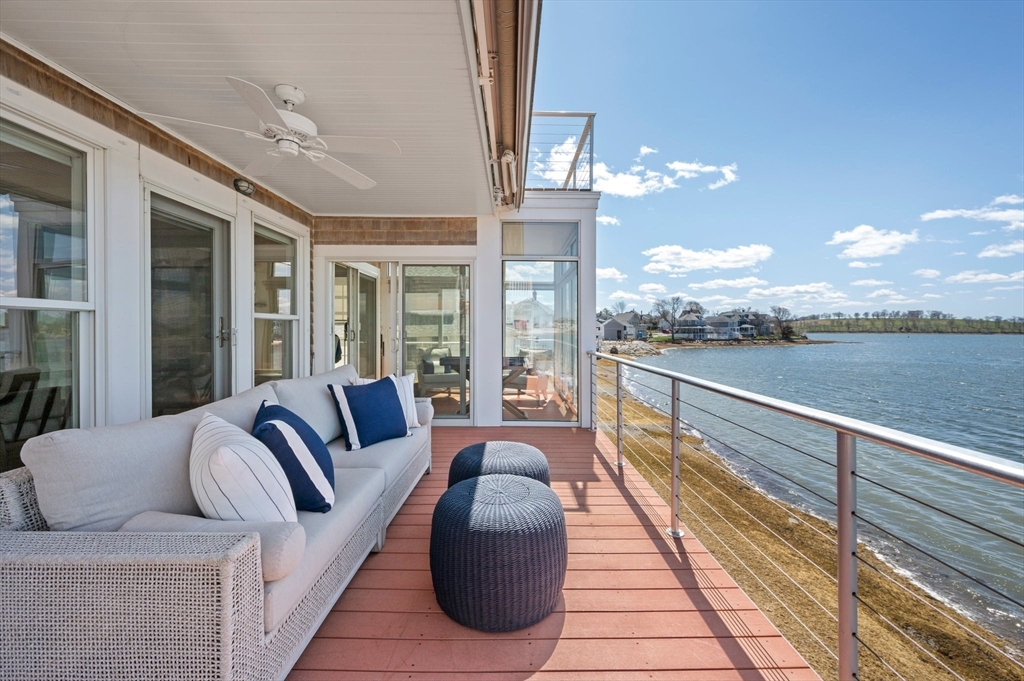 87 Bay Street Hull, MA 02045 - Photo 23 of 30 a living room with furniture and a large window