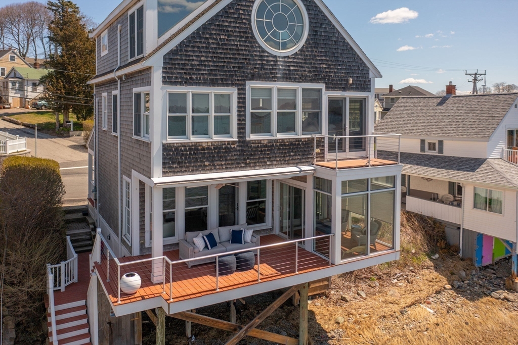 87 Bay Street Hull, MA 02045 - Photo 26 of 30 a view of a house with a balcony and a large window