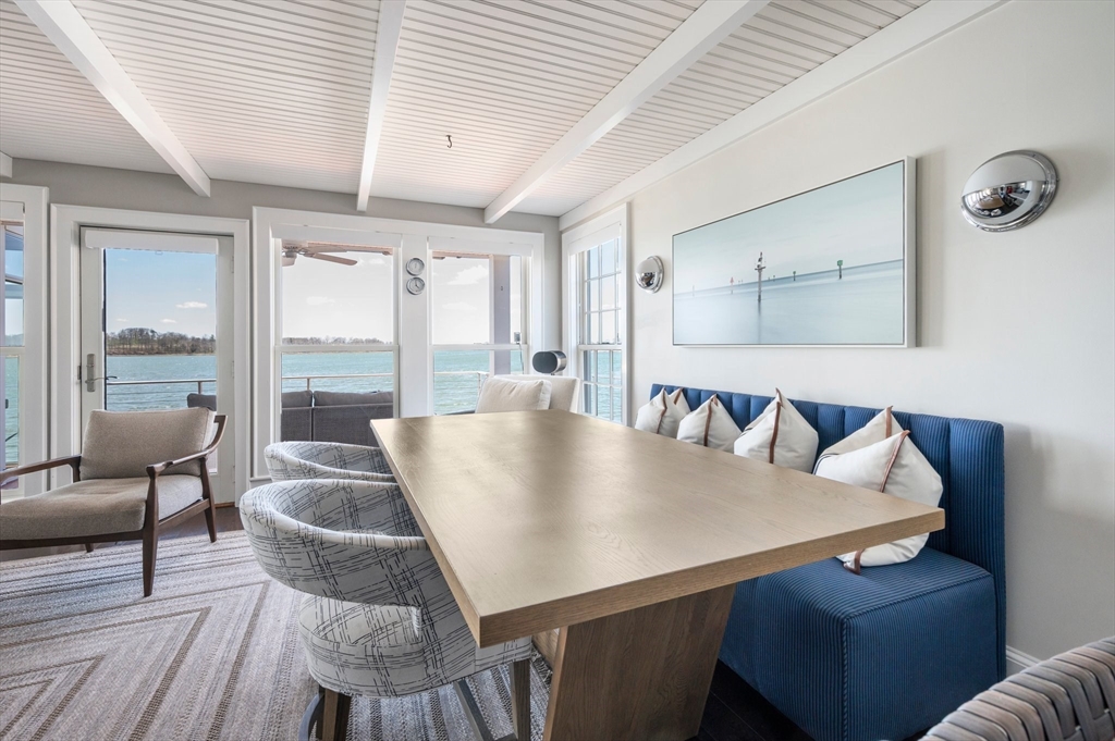 87 Bay Street Hull, MA 02045 - Photo 9 of 30 a view of a dining room with furniture and wooden floor